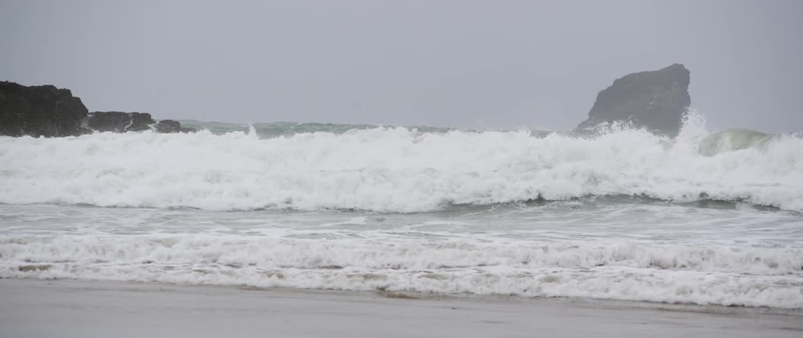Waves crashing around at the beach