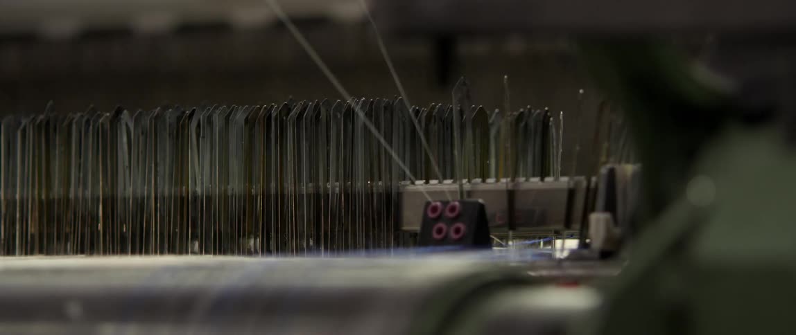 A machine threading strings