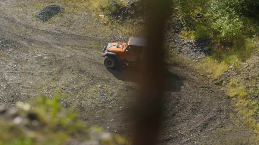 A jeep doing donuts in the gravel