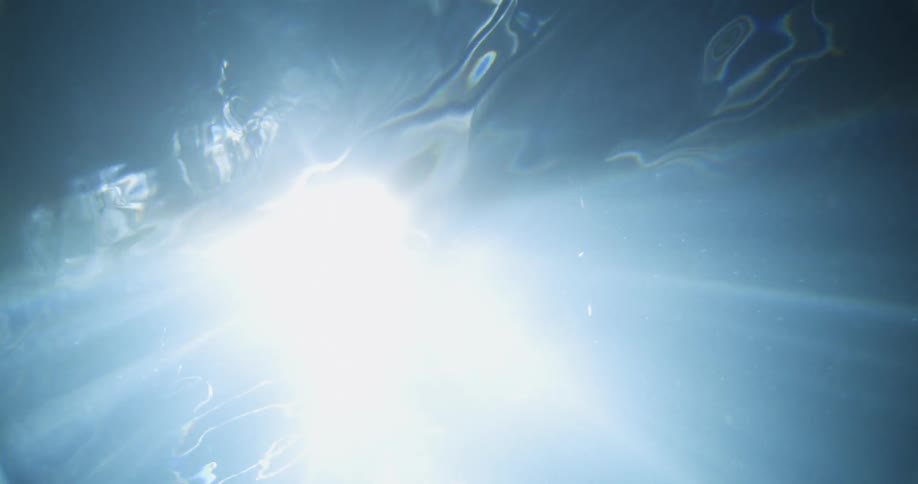Light shines down into a body of water