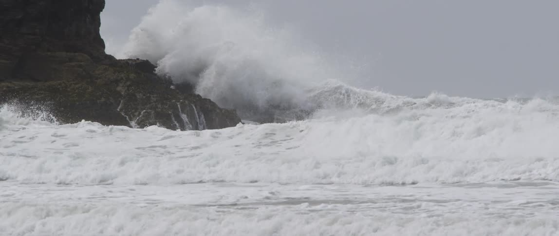 Strong waves rolling onto a rocky shore