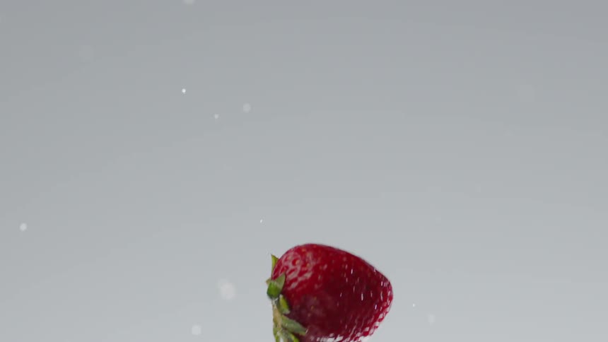 Strawberries being thrown into the air