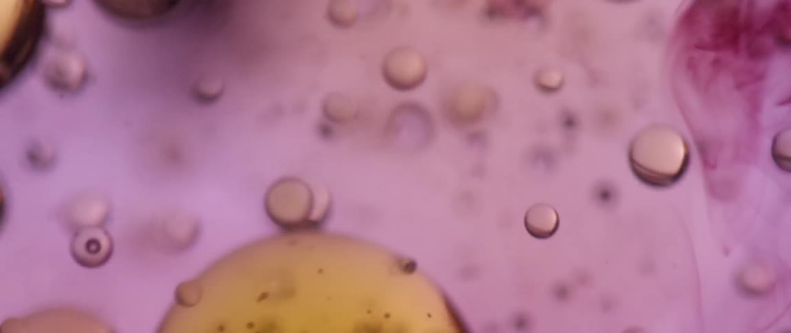 Colorful oil bubbles exploding