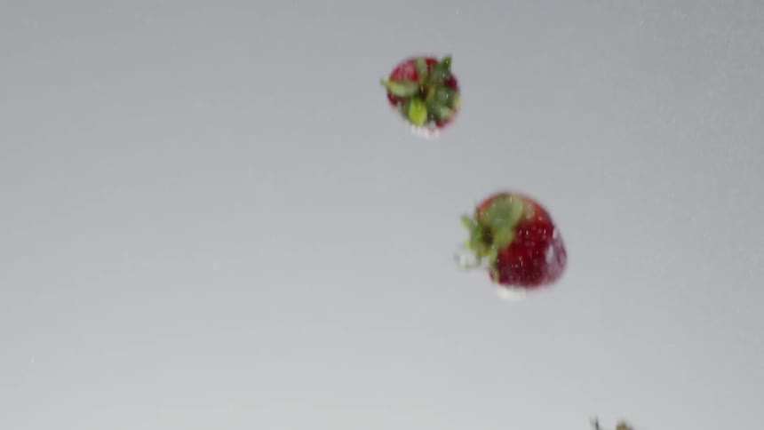 Strawberries fly through the air
