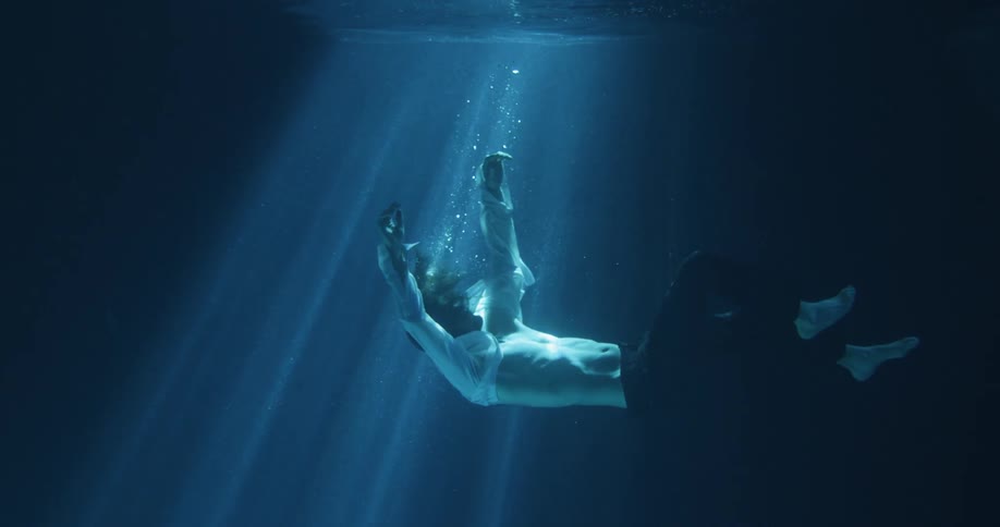 A man sinking underwater