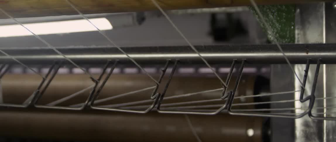 Threads wound through a machine