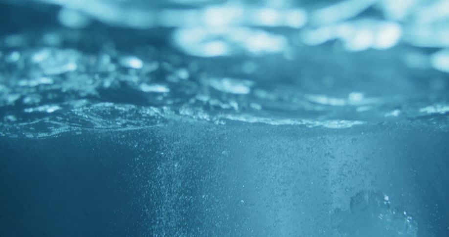 Oxygen bubbles rising to the water surface