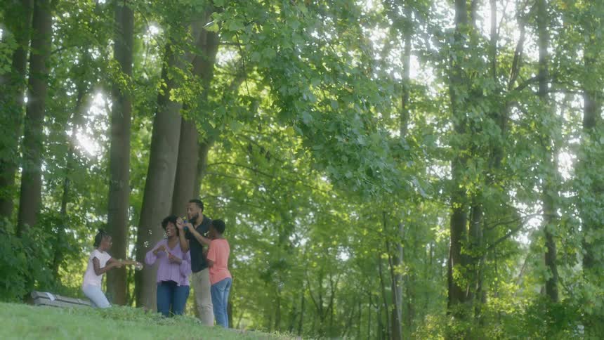 A family playing around in the woods