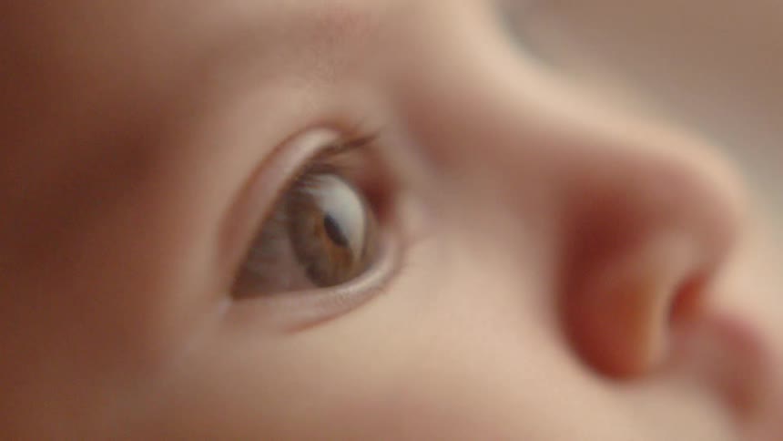 Baby's eye stares off into the distance
