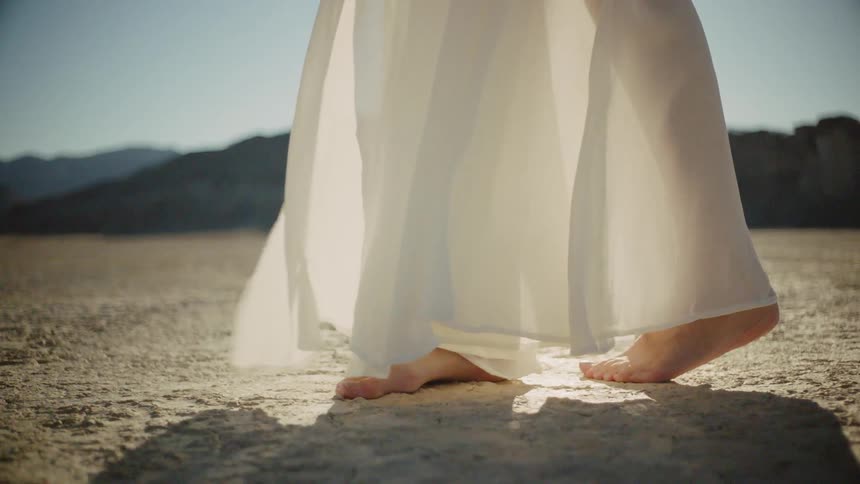 A woman's dress blowing in the wind
