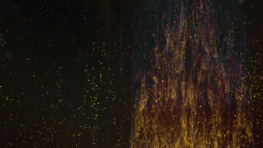 Orange liquid splashes down at night