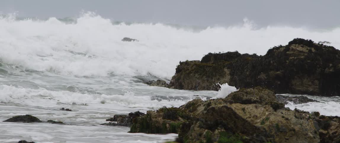 Ocean waves crashing on a rocky shoreline