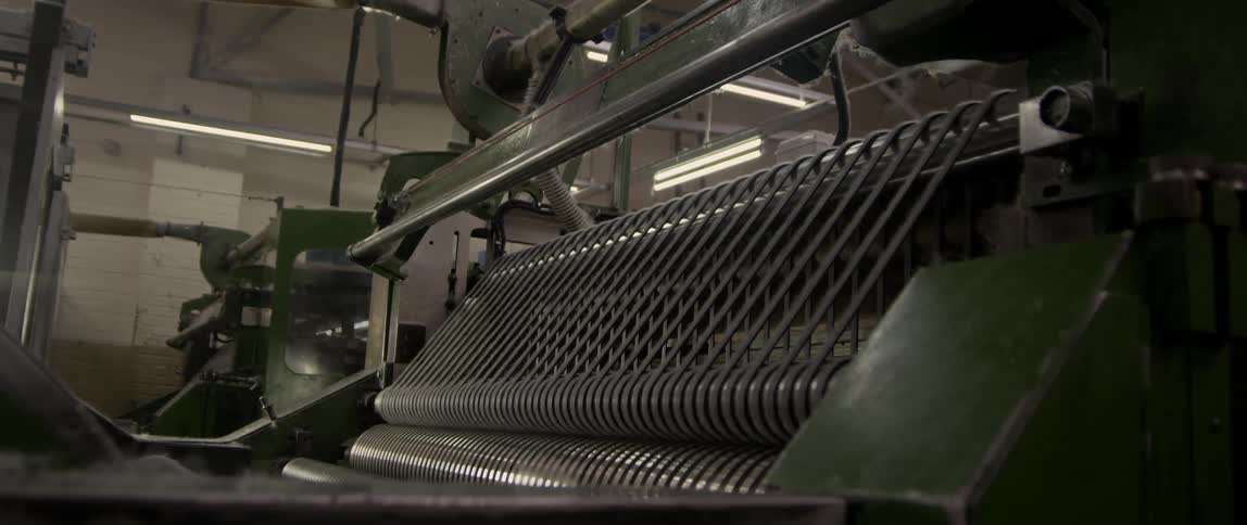 A machine spinning threads