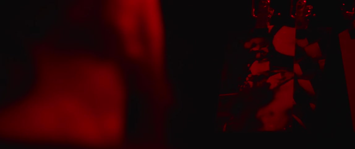 A man developing pictures in a dark room
