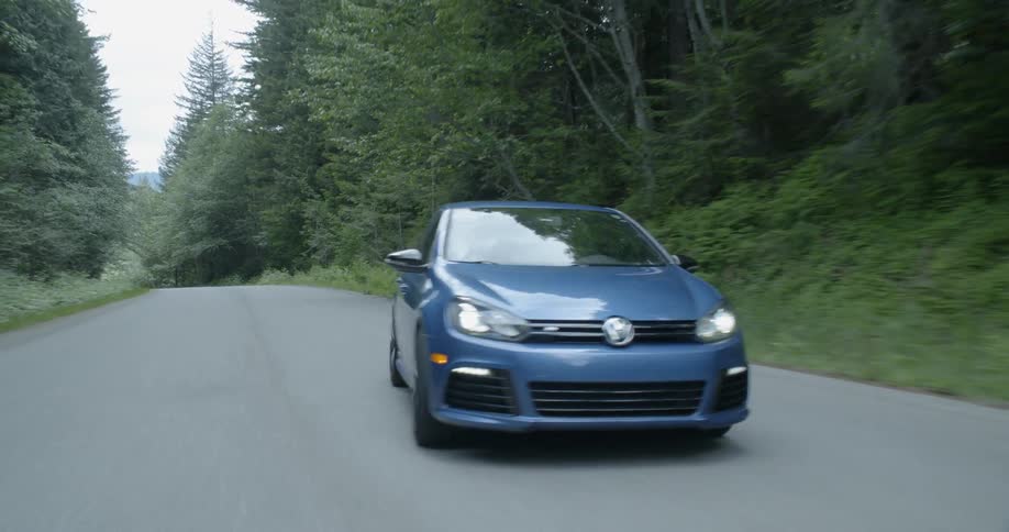 A car is driving on a road and swerving