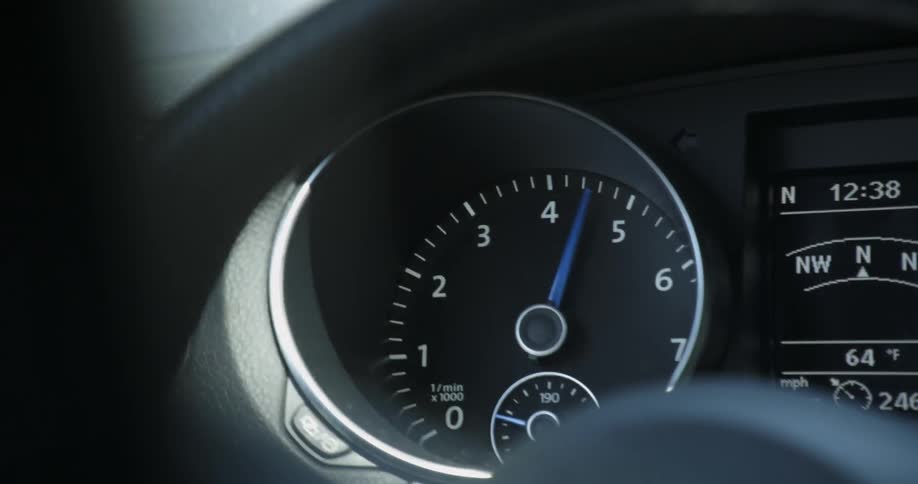 A car gauge shows rev up toward 5