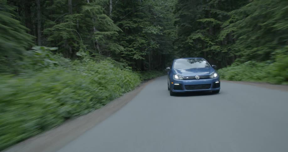 A vehicle is racing on the small road