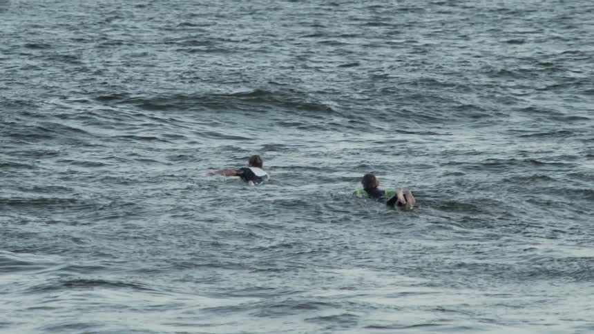 People swimming in water