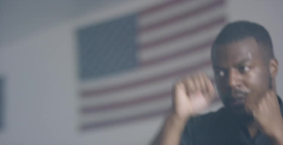 Man practicing boxing punches in the air