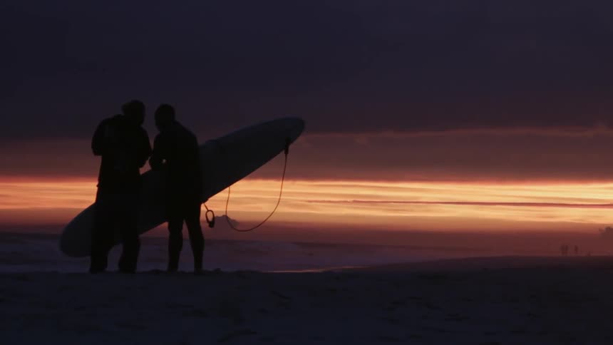 A person holding a surfboard