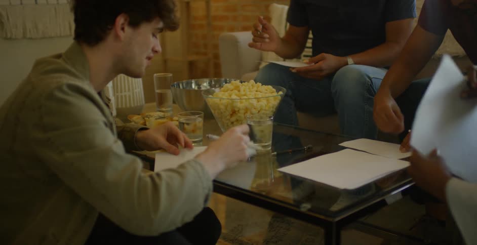 Friends Play Games And Eat Food In Loft