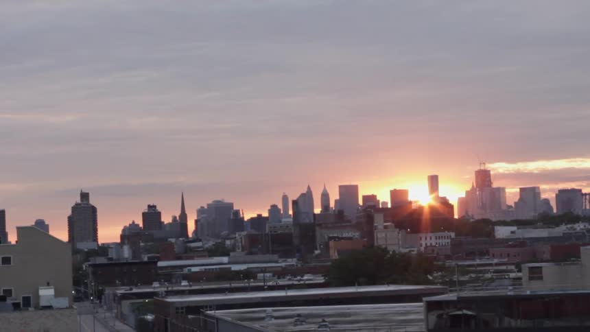 The sun setting over a cityscape