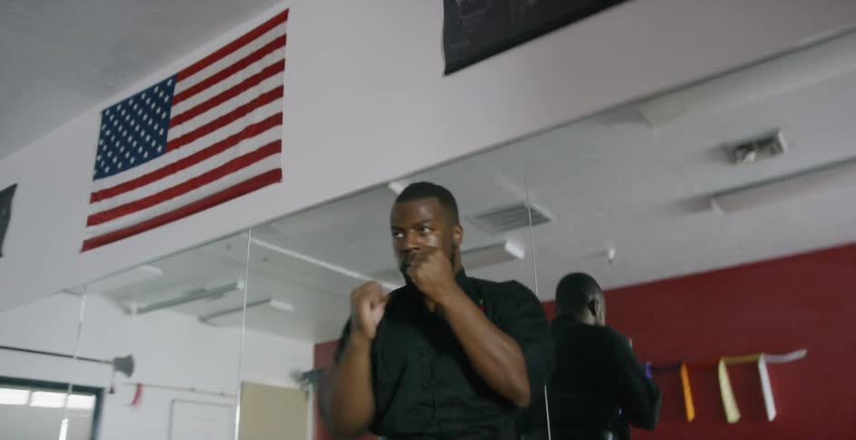 A man punching the air in a room