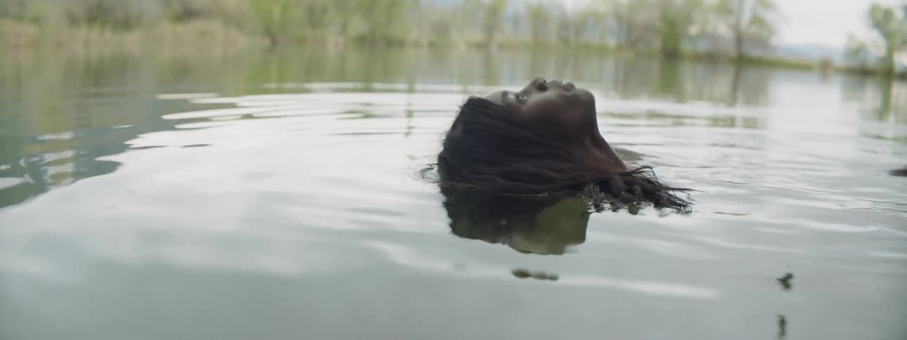 A woman laying in water