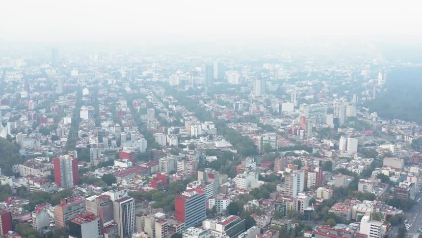 The fog is covering the city below