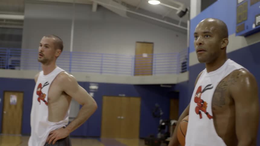 Two men in a basketball court