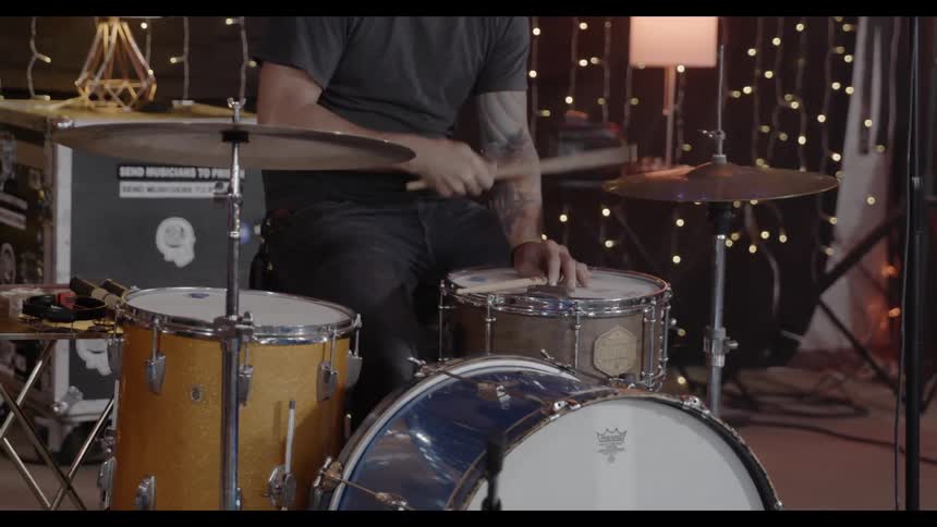 Drummer picking out a beat on his drums