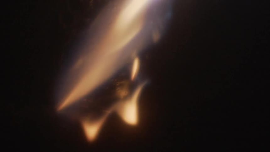 A blue fire burning metal