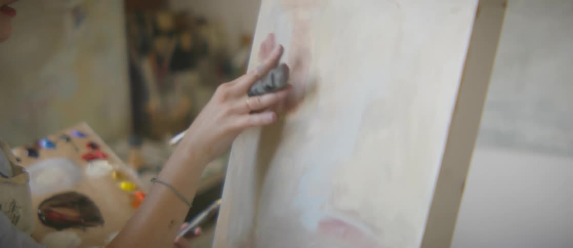 A woman is painting indoors