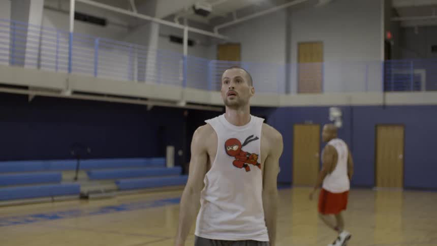 Some people playing basketball