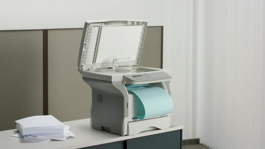 The copier is printing out paper