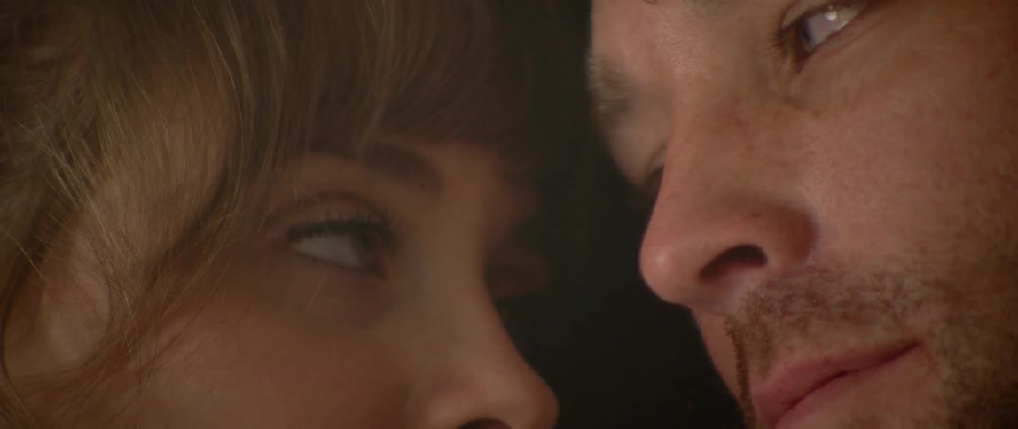 Man and woman rest head to head with each other