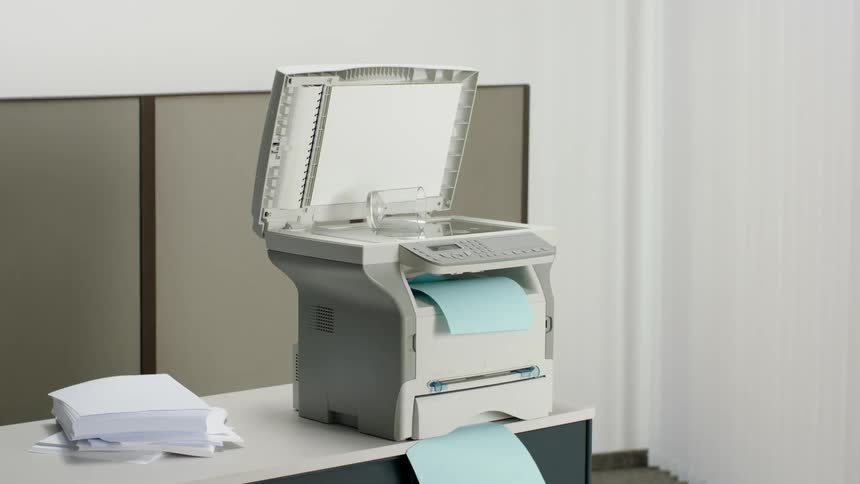 Copying machine prints documents in office