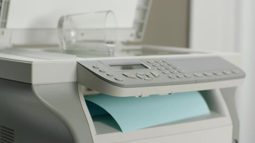 A printer that has blue sheets of paper printing out repeatedly