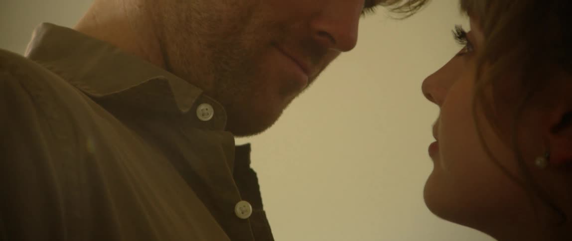 A man and woman gaze lovingly into each other's eyes
