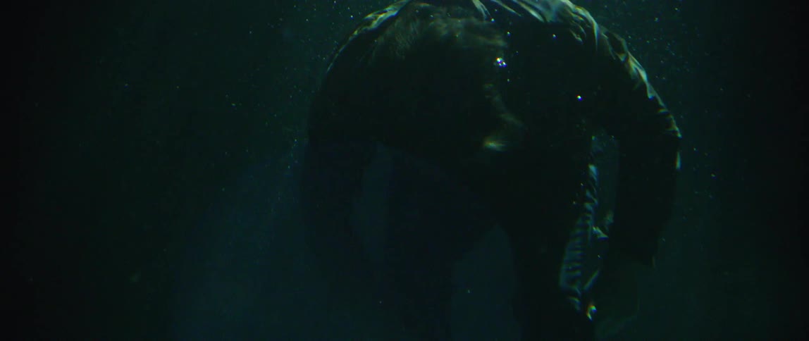 Couple On The Beach And In The Ocean