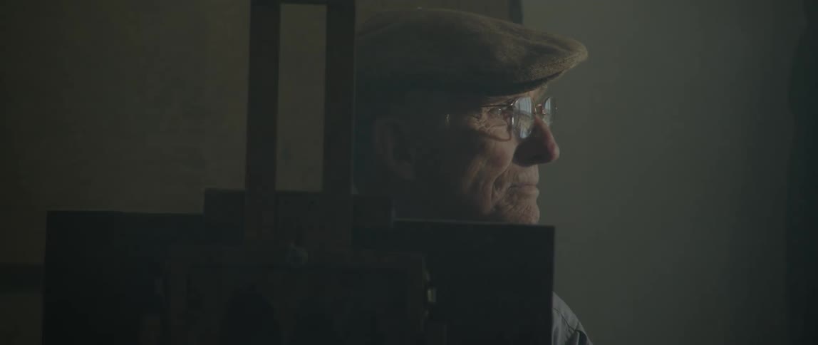 A man is smiling indoors