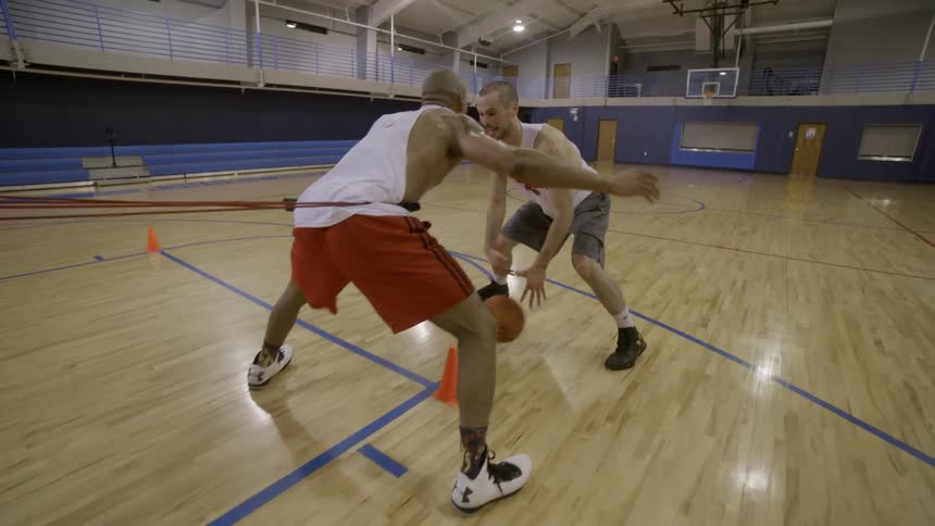 Some people playing basketball