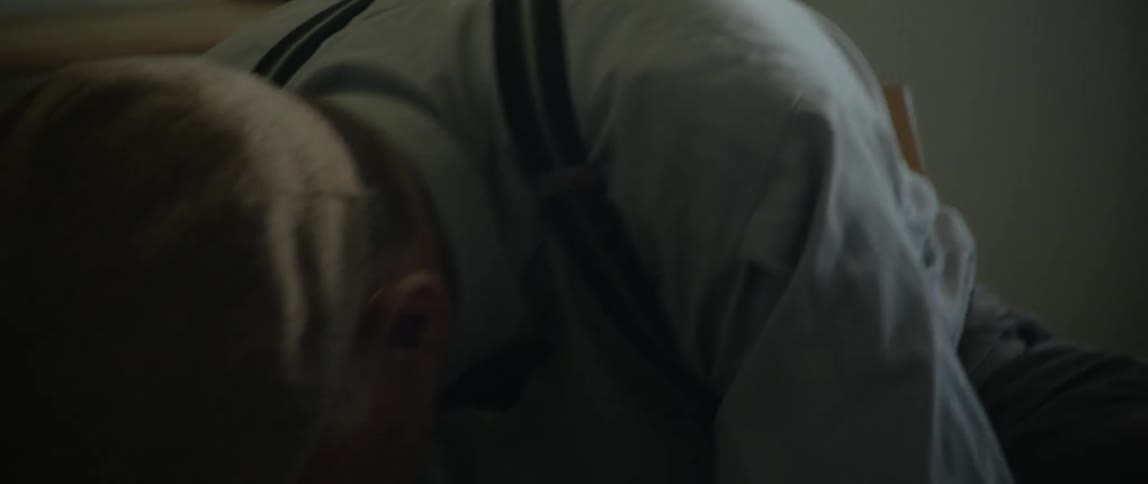 An old man cleaning up his paints