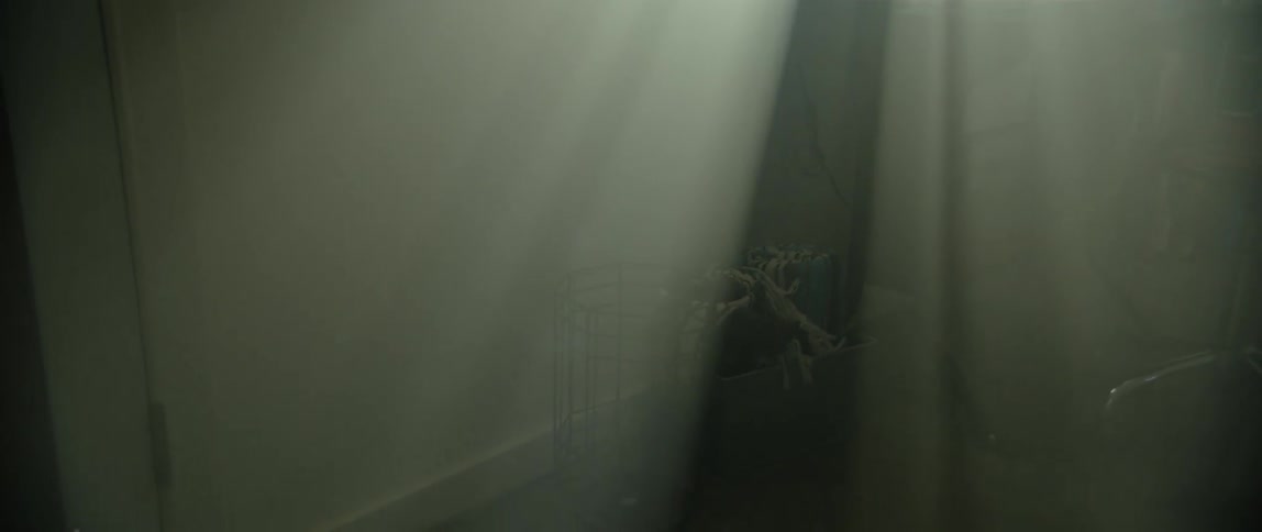 The light is shining in through the window of the basement