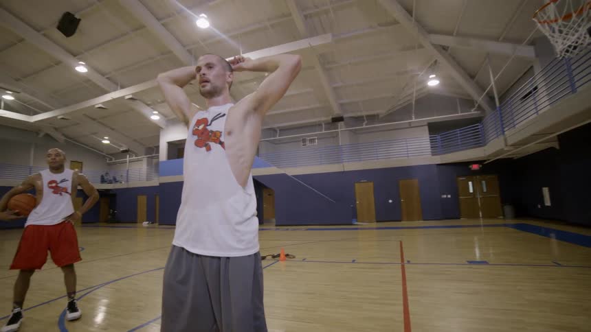 A person standing in a gym