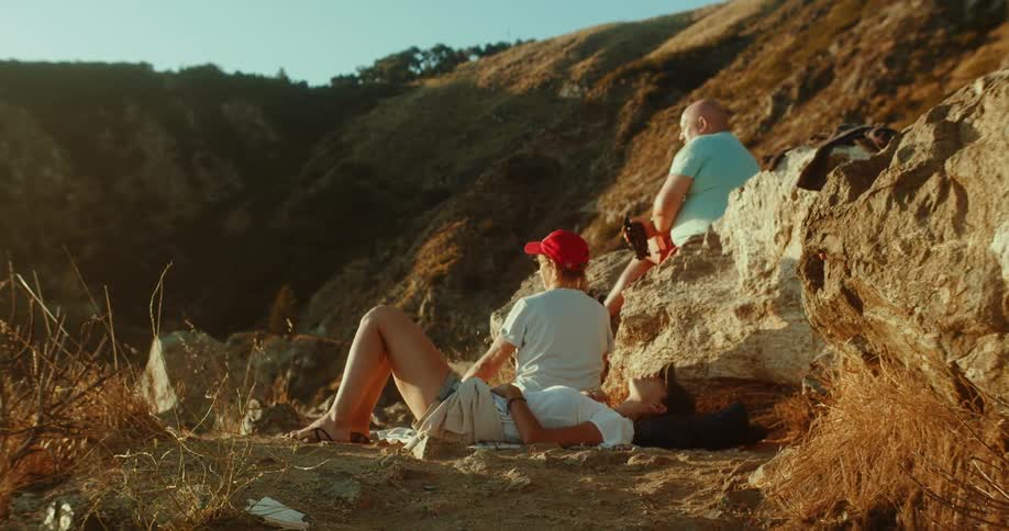 People are stopped to rest while hiking in mountains