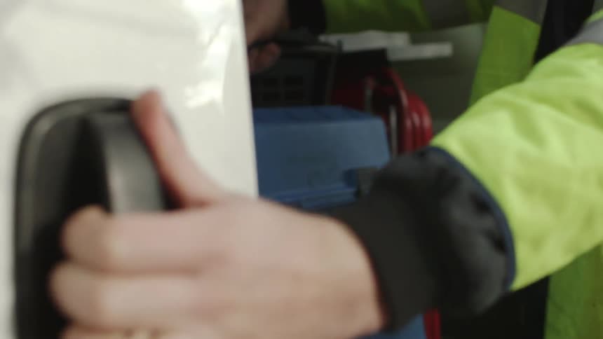 A person opening a door
