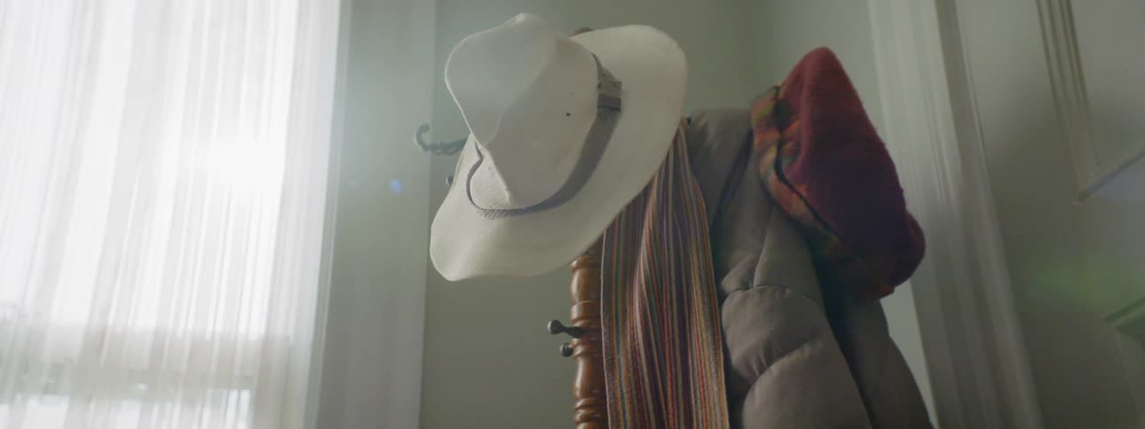 Hat scarf and coat on coat rack