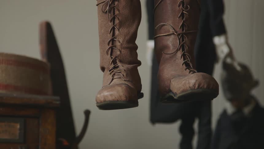 View of boots suspended in the air