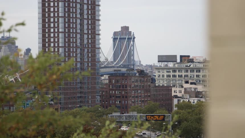 View of a downtown of a city with a bridge